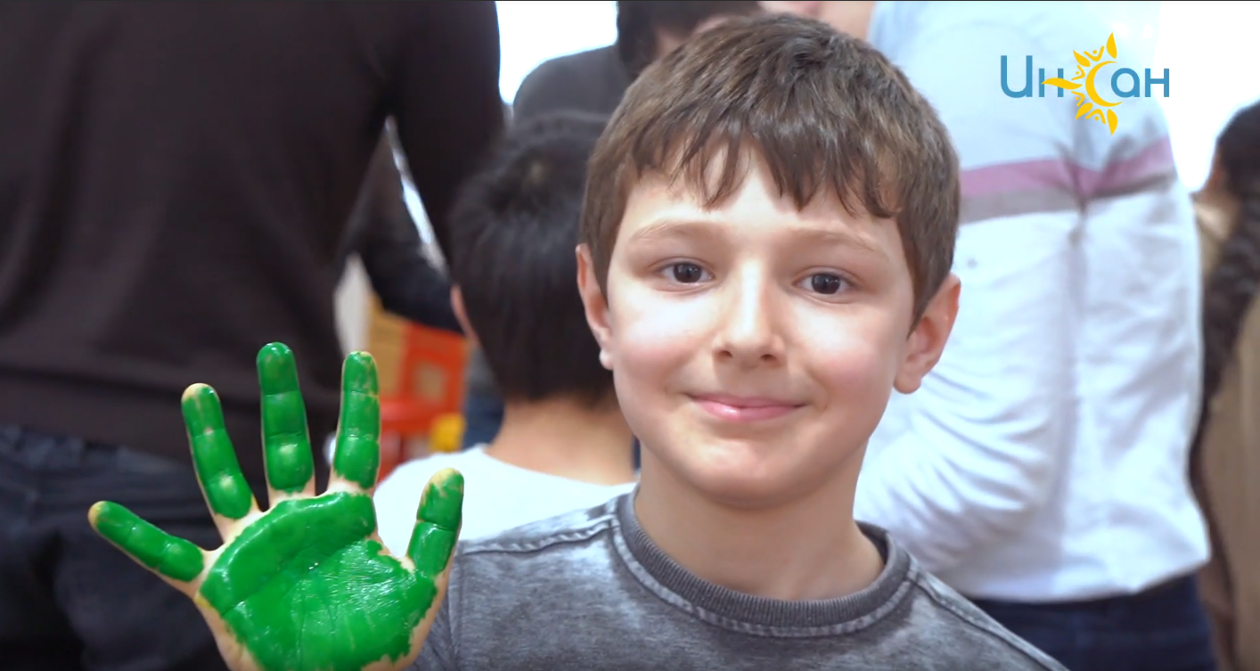 The kids painted a picture of friendship with their palms